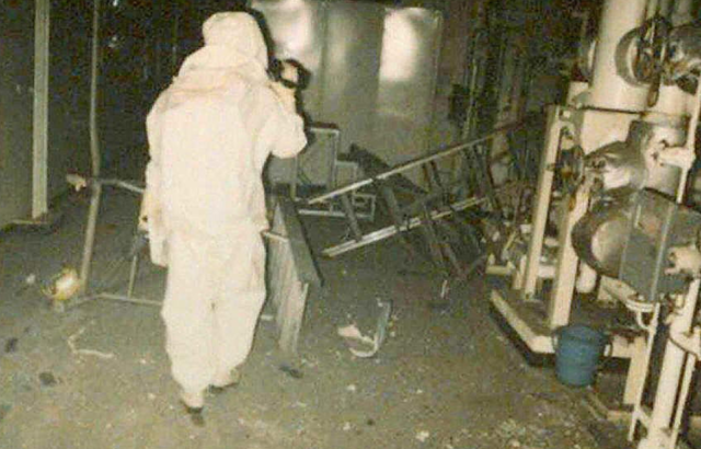 Investigators in protective suits examine the Tokaimura plant after the fatal criticality accident that exposed workers to lethal levels of radiation