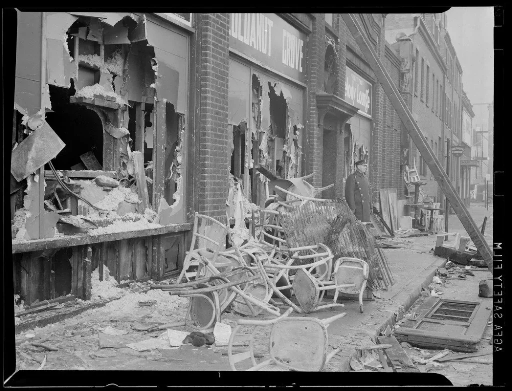 Chairs and wreckage outside the Cocoanut Grove nightclub in Boston, scene of the deadliest nightclub fire in US history. November 29, 1942
