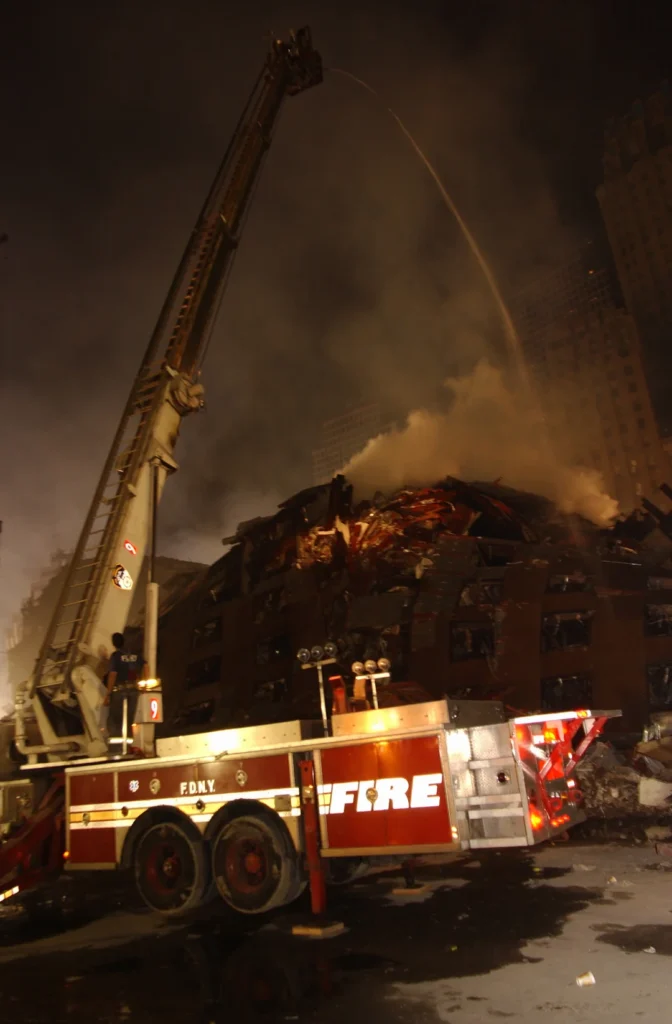 Firefighters at ground zero continue to battle smouldering fires amongst the wreckage of the World Trade Center. September 18, 2001