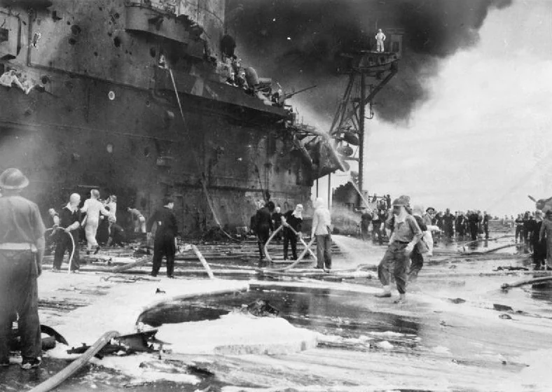 Firefighters tackling the blaze onboard HMS Formidable after being hit by a Kamikaze near Okinawa, 4th May 1945, 5 days later a second Kamikaze would crash into her flight deck killing 1 sailor and wounding 4 others