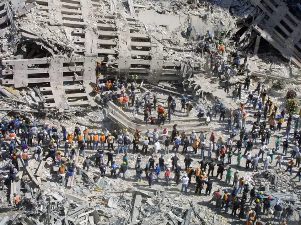 September 13, 2001 - Rescue workers sift through the wreckage on ground zero two days after the terrorist attack on the twin towers in New York.