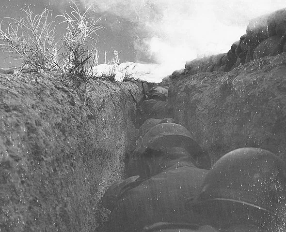 Soldiers take cover in a trench during an Atomic explosion. Upshot Knothole-Simon 1954