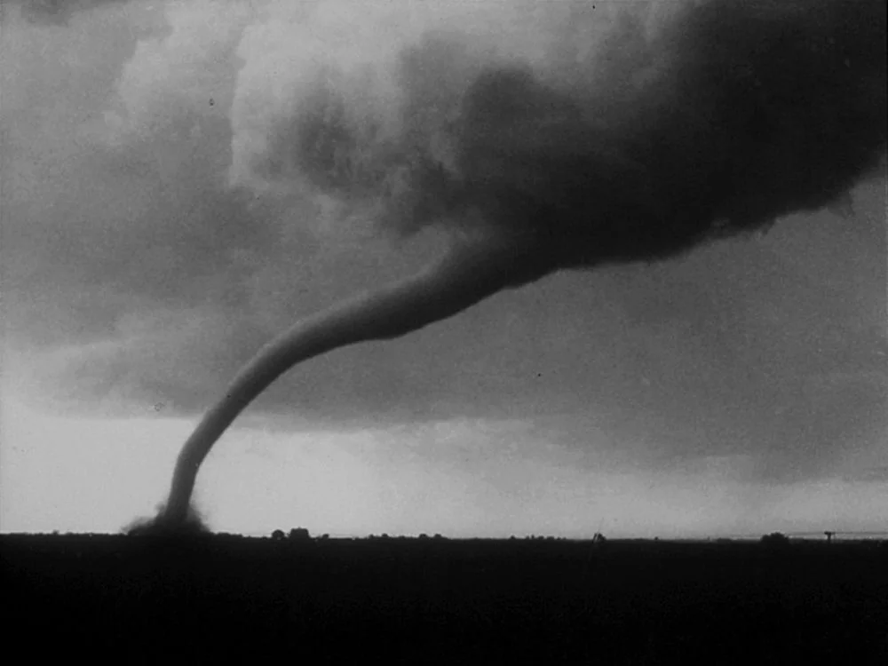 The June 13, 1968 tornado that struck Tracy Minnesota is photographed leaving town. Award-winning photo by Eric J. Lantz of Walnut Grove.